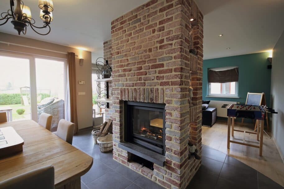 Glass-fronted gas fire set into a brick chimney breast
